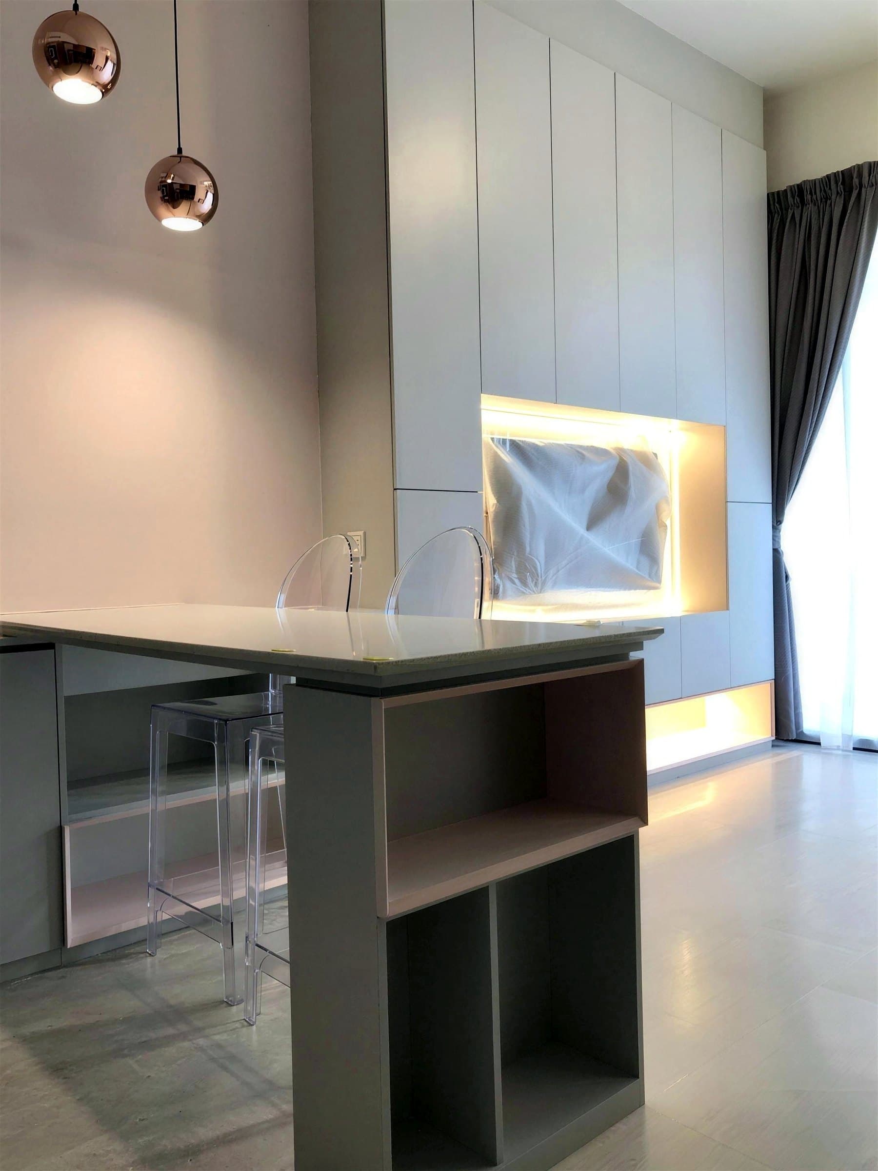 Bar island facing the backlit television wall
