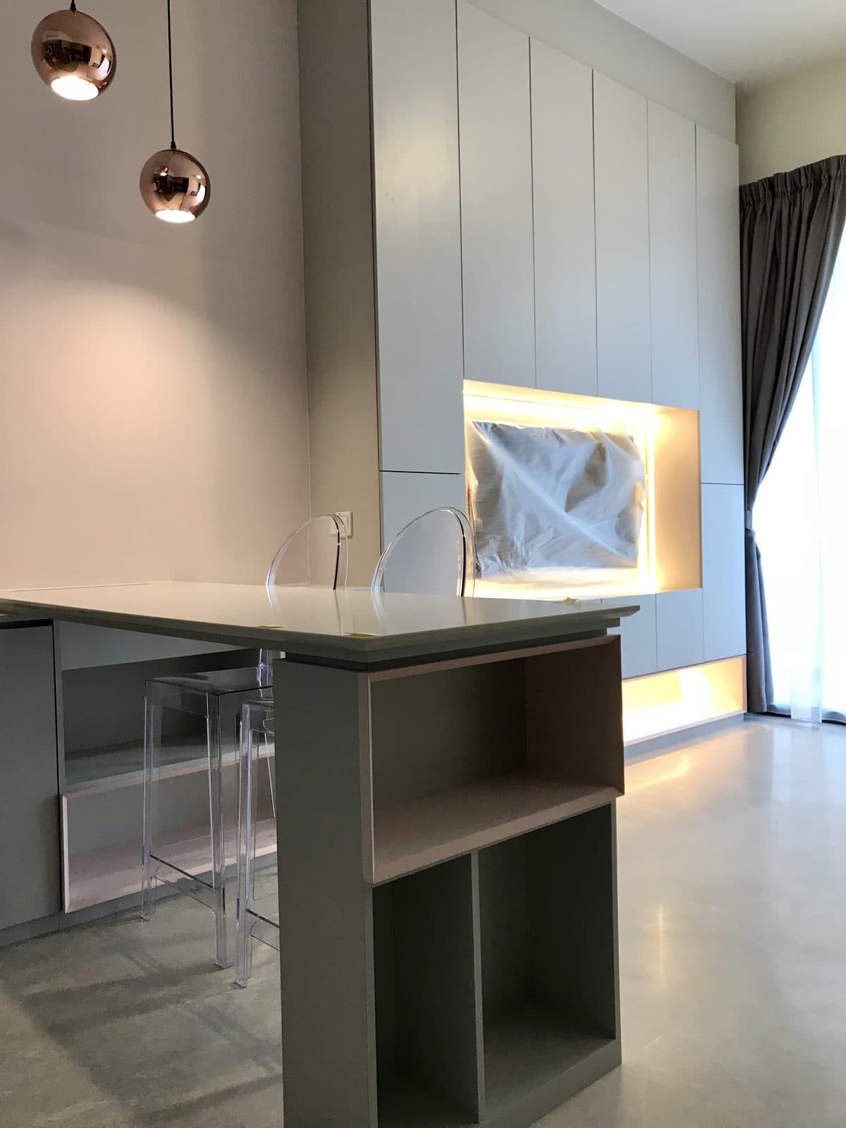 Bar island facing the backlit television wall