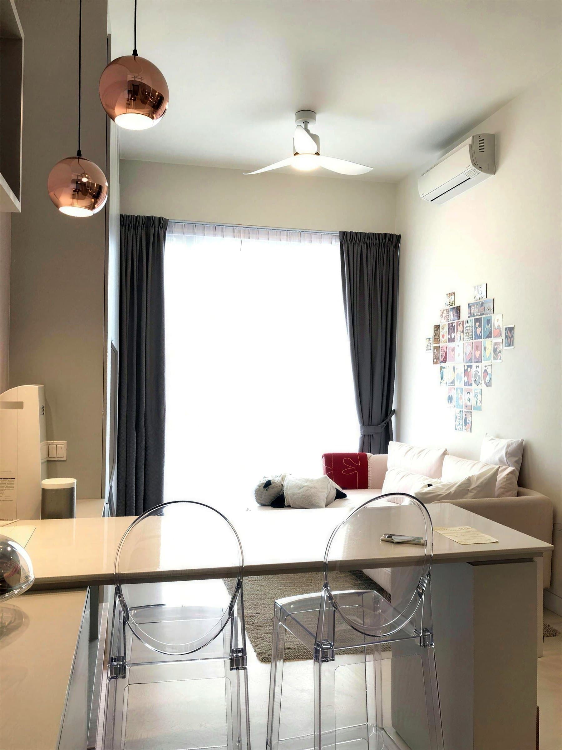 Highline Residences living and dining area with bar island and copper pendant lights