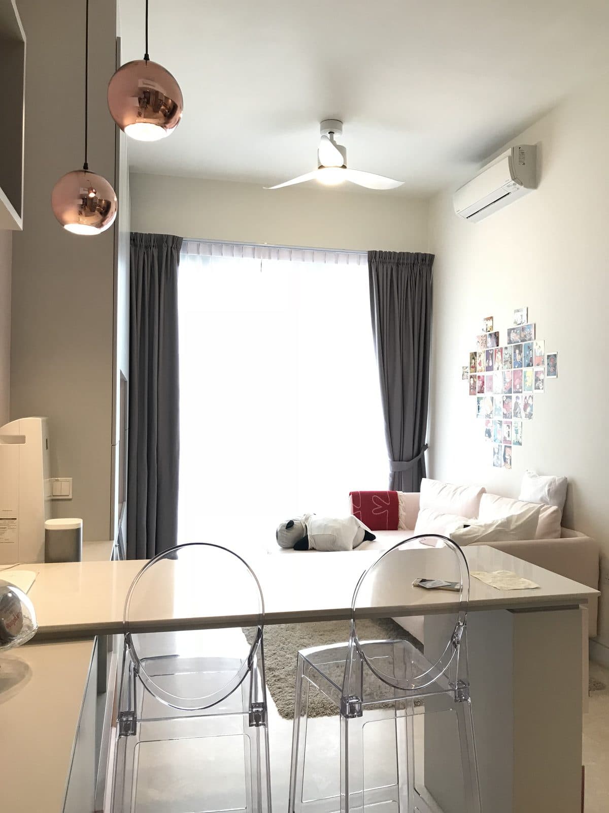 Highline Residences living and dining area with bar island and copper pendant lights
