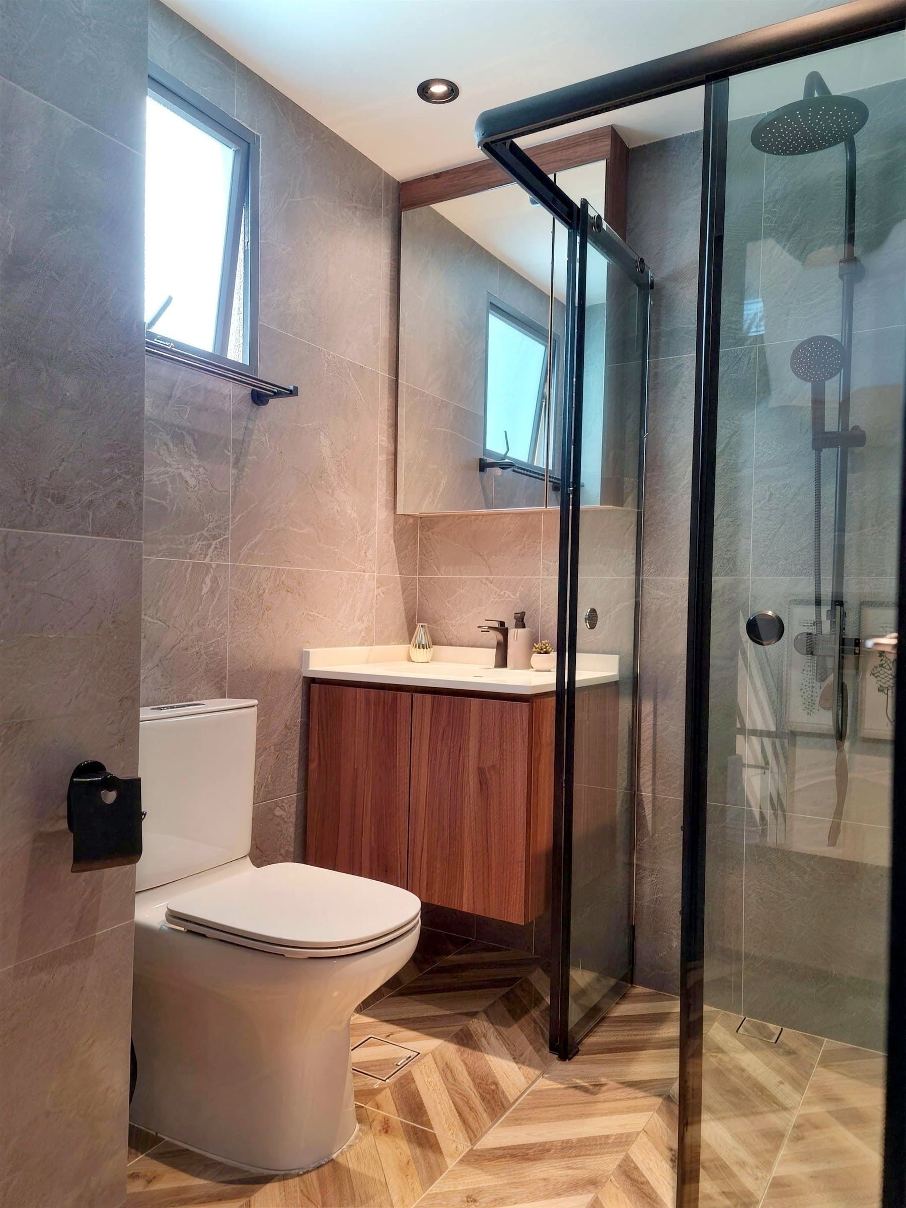 Bathroom with herringbone floor tile and a timber vanity