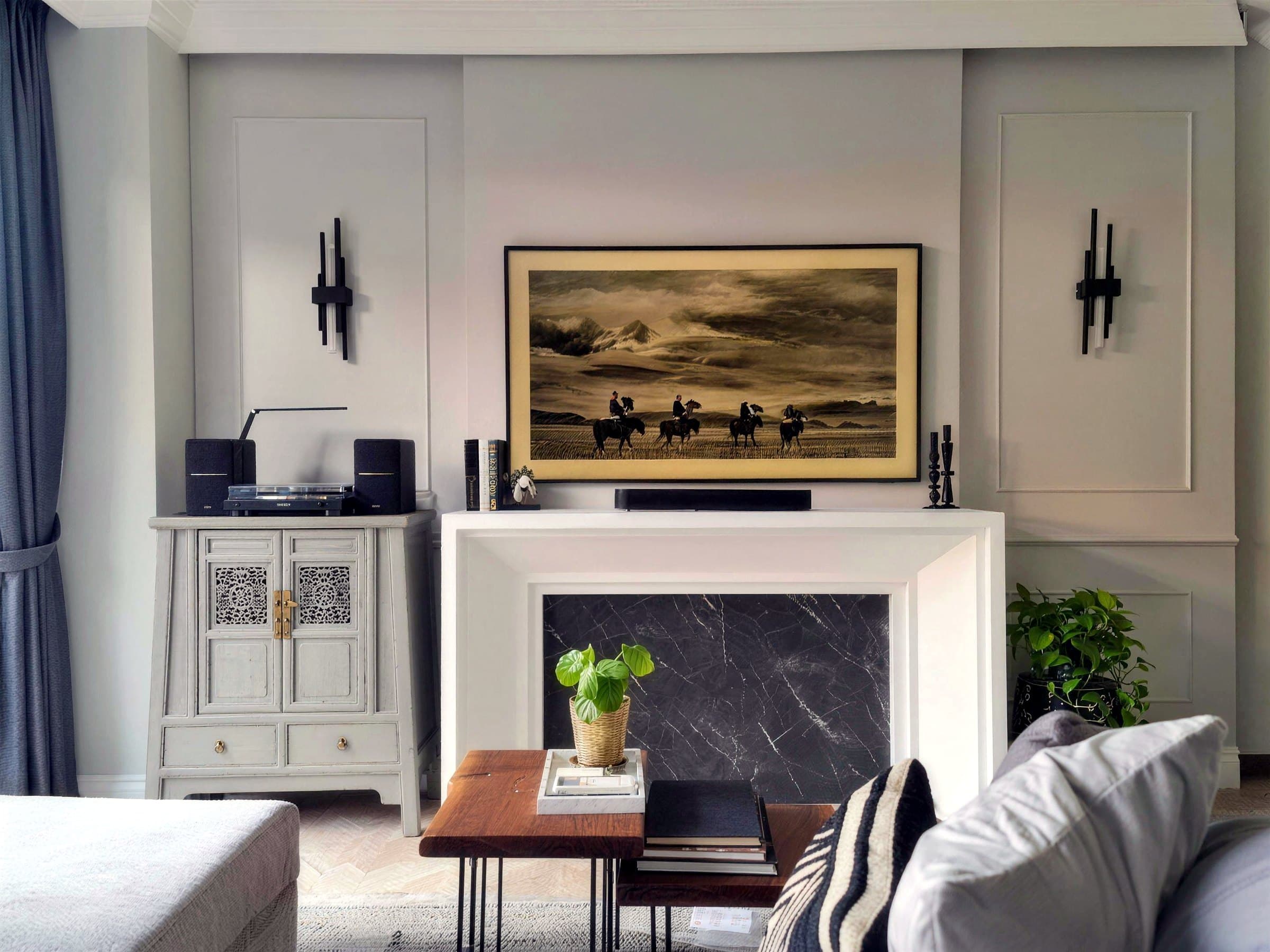 Kew Gate living room with a mantel-style feature wall, panel mouldings and art-deco sconces
