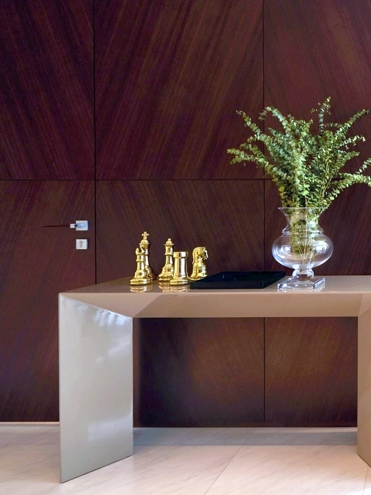 Foyer with full-height timber-veneer wall panelling