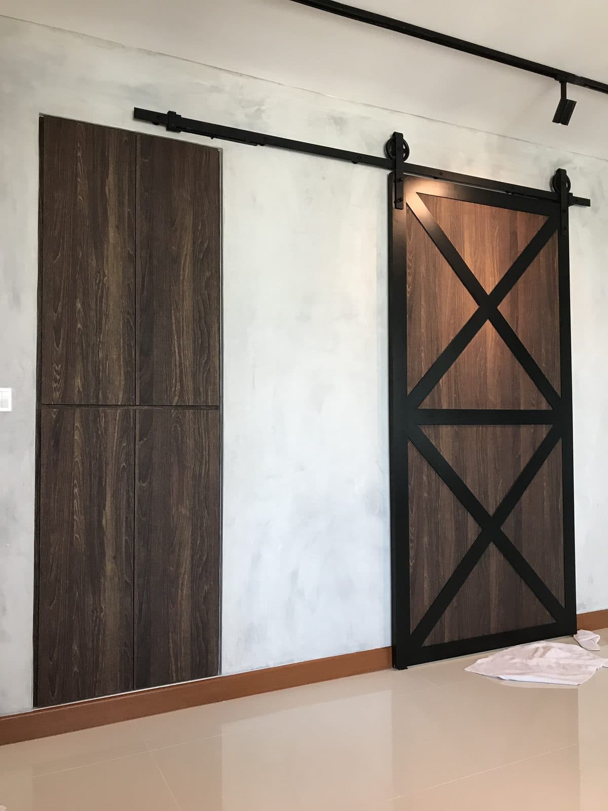 Sliding timber barn door on black track